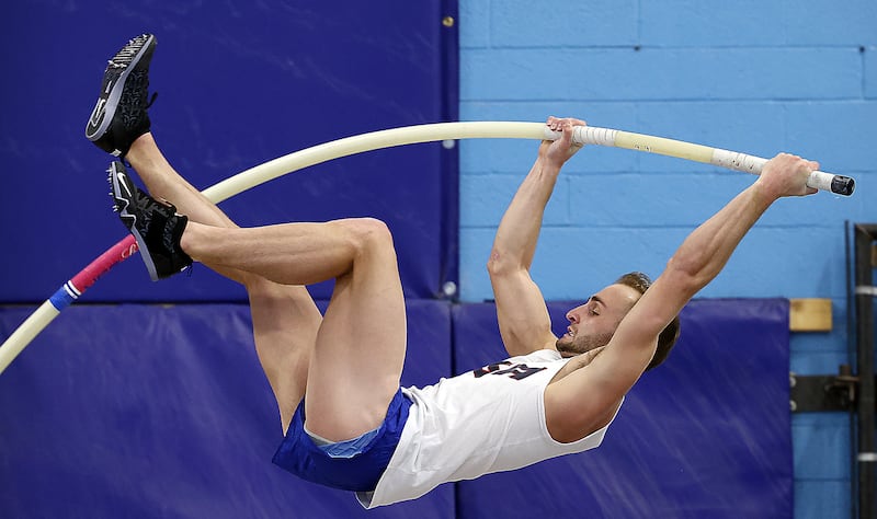 BYU pole vaulter Zach McWhorter goes up for a vault as he trains with his dad, Rick, who is also his coach.