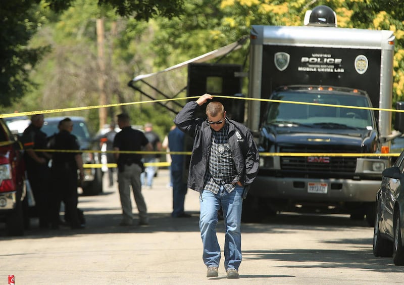 Police investigate a homicide in Magna on Sunday, July 16, 2017.