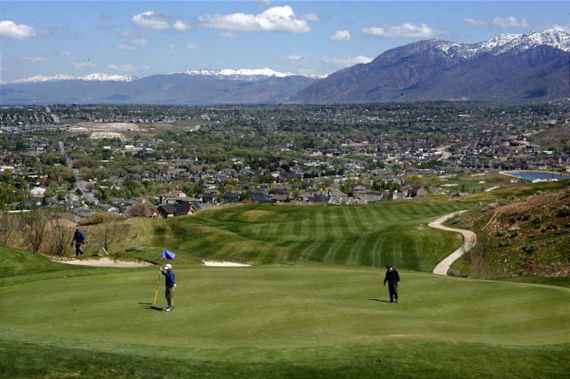 Dan, left, and Jeremy Telford finish their golf round at South Mountain Golf Club. The county fought hard to buy it, finally purchasing it for $17 million.