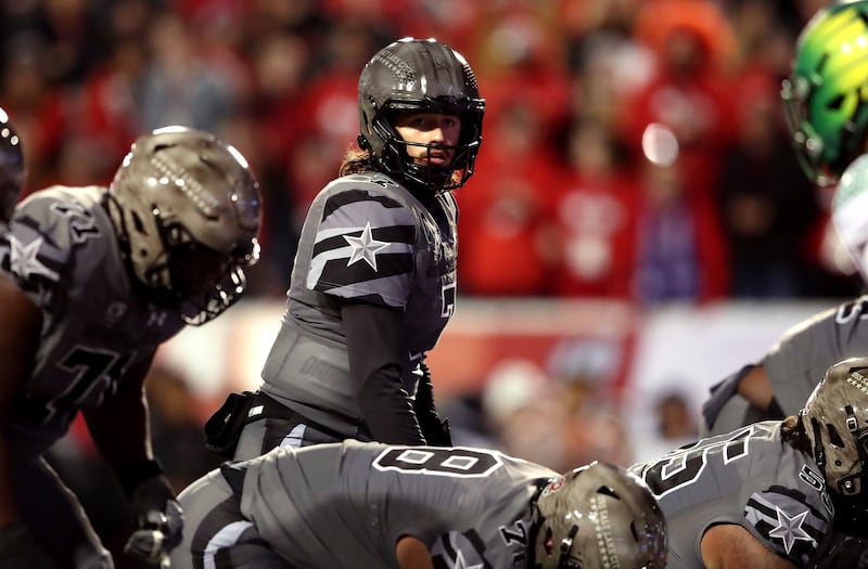 Utah QB Cameron Rising looks across the line as Utah and Oregon play at Rice-Eccles Stadium in Salt Lake on Nov. 20, 2021.