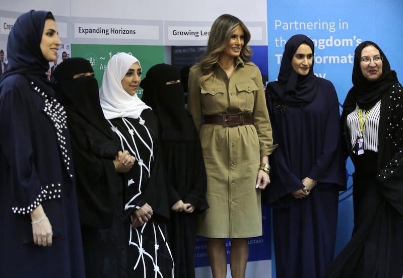 FILE - U.S. First Lady Melania Trump poses for a photo with Saudi women on a visit to an all-women's business services center in Riyadh, Saudi Arabia, Sunday, May 21, 2017. Saudi Arabia says it will allow women to drive for the first time in the ultra-con