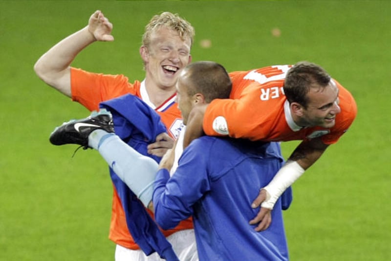 The Netherlands' Wesley Sneijder, right, Arjen Robben, center, and Dirk Kuyt celebrate their team's 4-1 victory against France toward the end of the Euro 2008 Group C match in Bern, Switzerland.