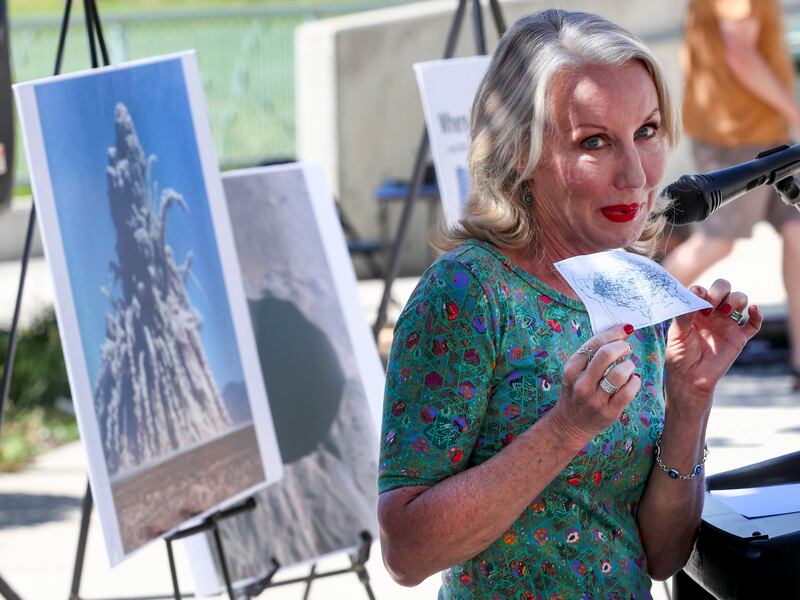 Mary Dickson holds up a map that she keeps with her that shows the path of nuclear fallout from at least three nuclear tests in Nevada.
