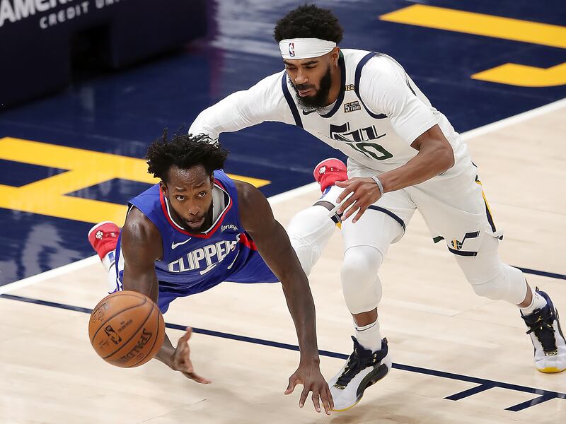 LA Clippers guard Patrick Beverley (21) and Utah Jazz guard Mike Conley (10) chase down the ball