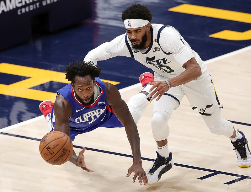 LA Clippers guard Patrick Beverley (21) and Utah Jazz guard Mike Conley (10) chase down the ball