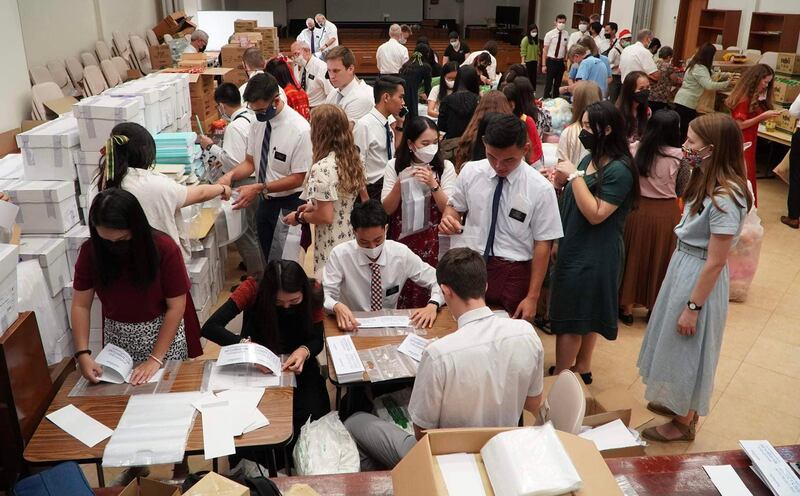 Latter-day Saint missionaries serving in Thailand participate in a service project as part of the “Light the World” initiative.