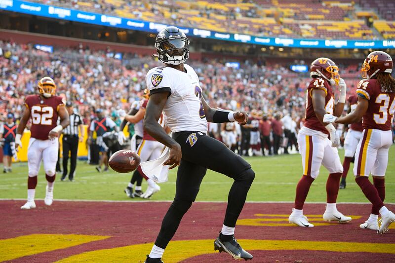 Baltimore Ravens quarterback Tyler Huntley (2) celebrating his touchdown against the Washington Football Team.
