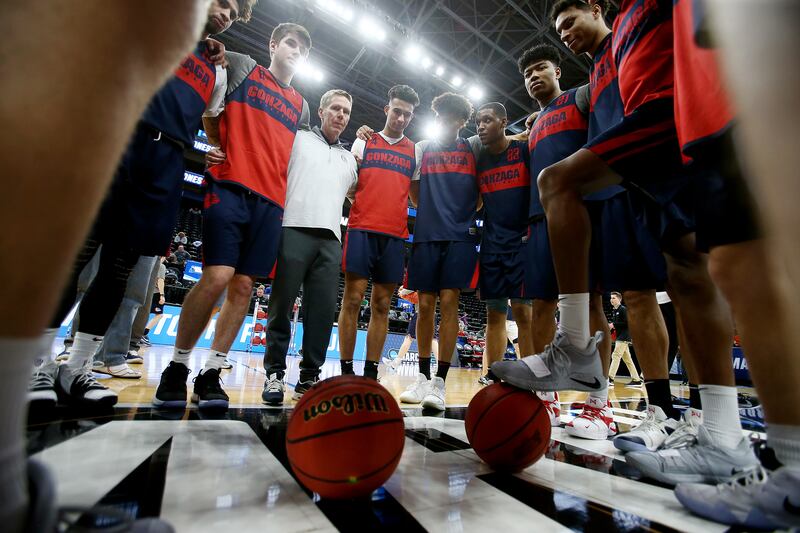 Gonzaga Bulldogs head coach Mark Few gathers his players at midcourt after they practiced at Vivint Arena.