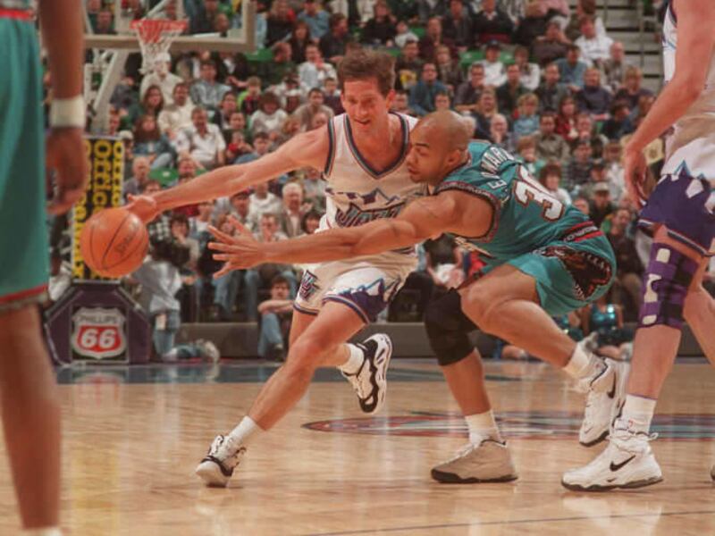 Jeff Hornacek drives past Blue Edwards during the Jazz game against the Vancouver Grizzlies on April 4, 1997 in Salt Lake City. Photo by Carmen Troesser.