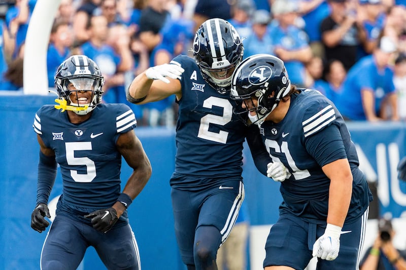 BYU Cougars wide receivers Darius Lassiter (5) and Chase Roberts (2) celebrate a TD.