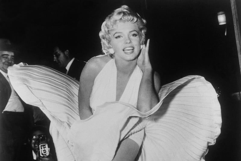 In this Sept. 9, 1954, file photo, Marilyn Monroe poses over the updraft of a New York subway grate while filming “The Seven Year Itch.”