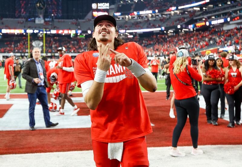 Utah Utes QB Cameron Rising points to his finger
