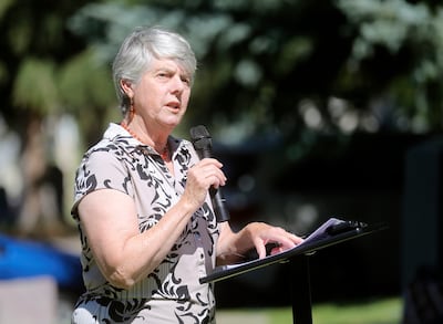 Laurie Bryant, a retired writer, speaks during a dedication ceremony on Tuesday, July 2, 2019, for a new granite marker at the Salt Lake City Cemetery memorializing those who died in the state’s first insane asylum.