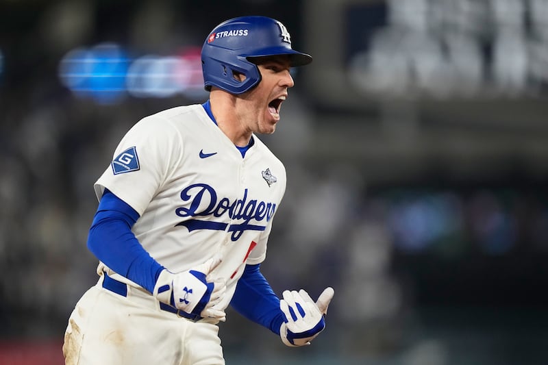 Los Angeles Dodgers' Freddie Freeman celebrates his walk-off home run against the Toronto Blue Jays during the 18th inning in Game 3 of the World Series, Monday, Oct. 27, 2025, in Los Angeles.