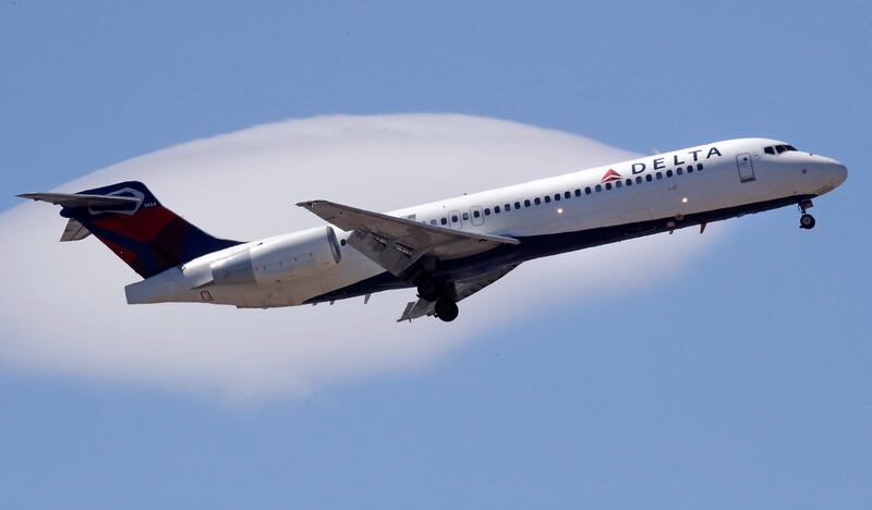 In this May 24, 2018, file photo, a Delta Air Lines passenger jet plane, a Boeing 717-200 model, approaches Logan Airport in Boston.