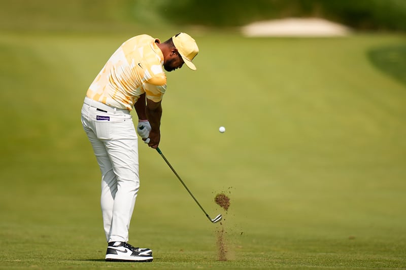 Tony Finau hits from the fairway on the second hole during the first round of the PGA Championship.