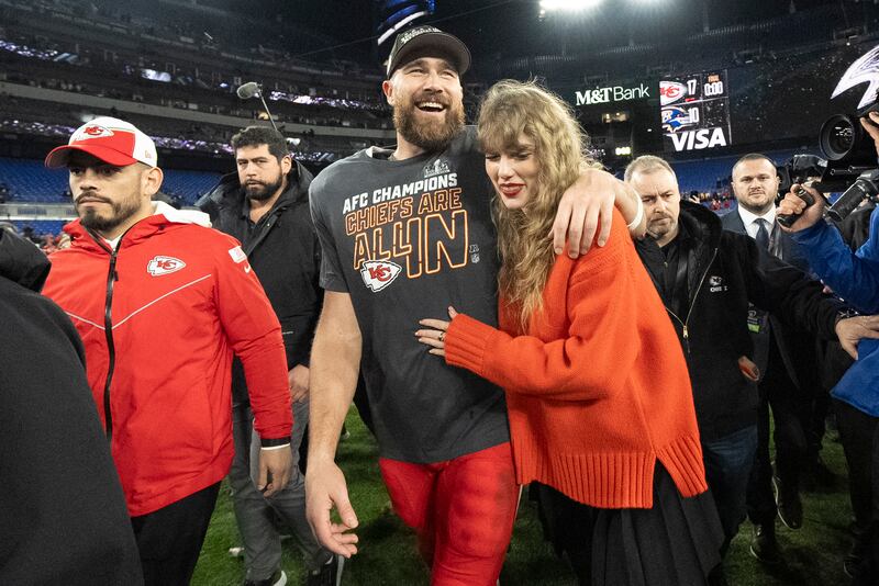 Kansas City Chiefs tight end Travis Kelce and Taylor Swift walk together after the AFC Championship game between the Chiefs and the Baltimore Ravens on Jan. 28, 2024, in Baltimore.