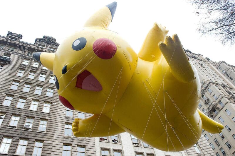 FILE - This Nov. 26, 2009 file photo shows the Pikachu Pokemon balloon floating down Central Park West during the Macy’s Thanksgiving Day Parade in New York. The parade has to be a crowd-pleaser for a multigenerational crowd. More than 3 million people ty