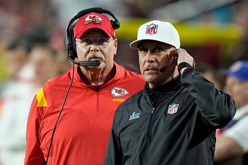 Kansas City Chiefs head coach Andy Reid, left, stands near an official on the sidelines during the first half of the NFL Super Bowl 57 football game between the Kansas City Chiefs and the Philadelphia Eagles, Sunday, Feb. 12, 2023, in Glendale, Ariz.