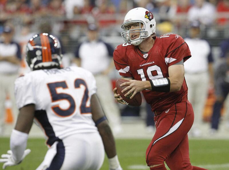 Arizona Cardinals' John Skelton, right, looks for an open receiver as Denver Broncos' Jason Hunter (52) closes to defend in the first quarter of an NFL football game Sunday, Dec. 12, 2010, in Glendale, Ariz.