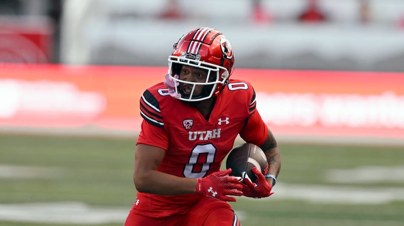 Utah wide receiver Mikey Matthews runs after making the catch during game against the Florida Gators in Salt Lake City.