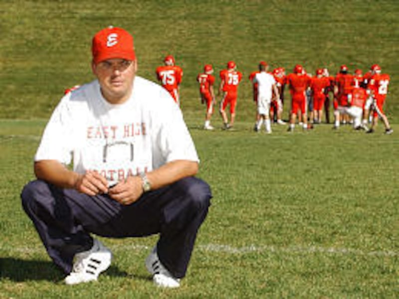First-year East head football coach Aaron Whitehead conducts practice at the Salt Lake high school.
