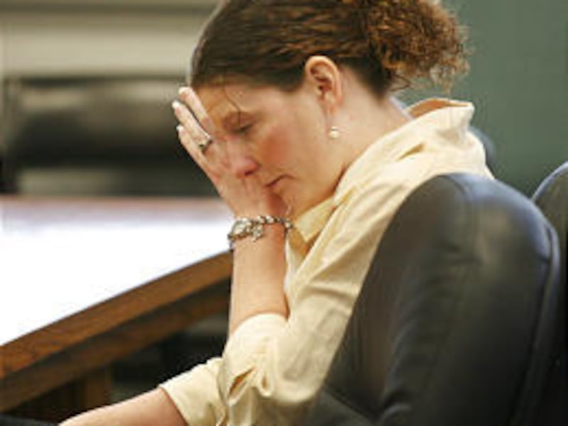 Jennete Killpack wipes away a tear during sentencing.