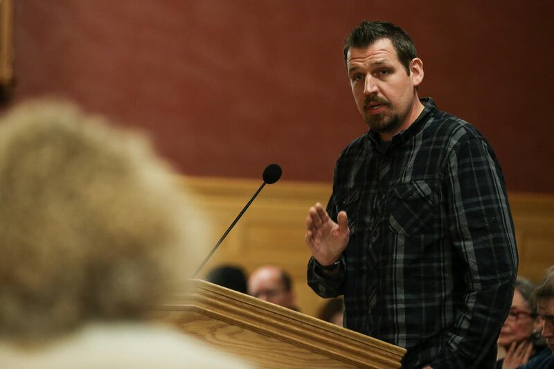 Chris Sveiven, right, expresses to Mayor Jackie Biskupski, left, and the city council his opposition to the proposed homeless shelter in his neighborhood at a city council meeting at the City and County Building in Salt Lake City on Tuesday, Jan. 03, 2017