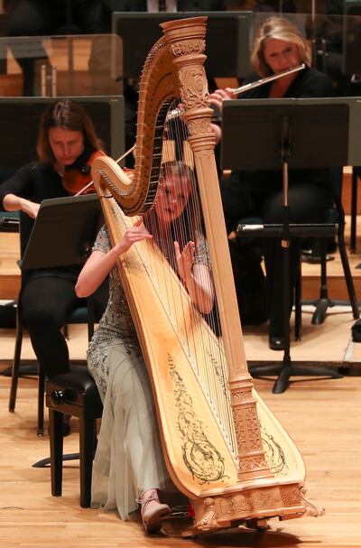 Erika Rosen plays the harp with the Utah Symphony during the 59th annual Salute to Youth concert, an event where young musicians perform classical masterpieces as soloists, at Abravanel Hall in Salt Lake City on Tuesday, Sept. 11, 2018.