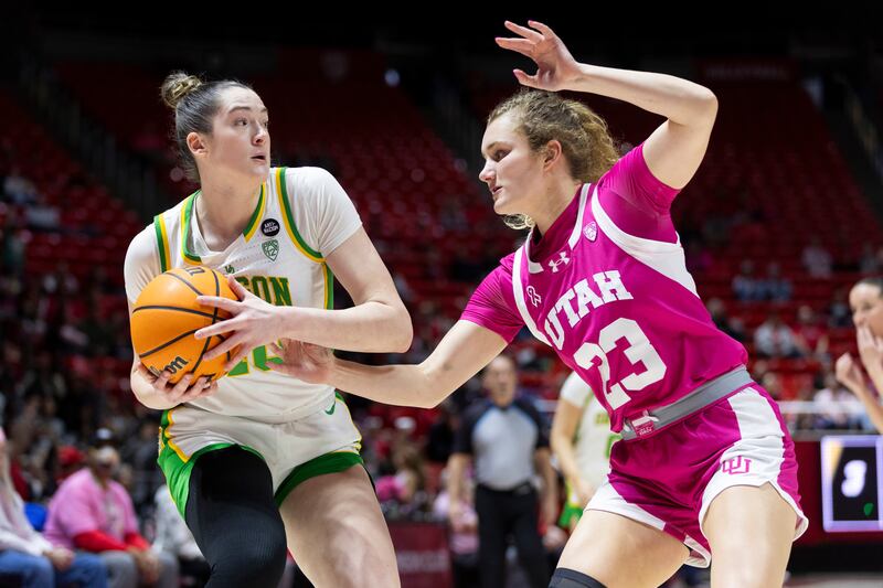Utah Utes guard Matyson Wilke (23) defends against Oregon Ducks forward Grace VanSlooten (40) during a game at the Huntsman Center in Salt Lake City on Saturday, Feb. 11, 2023.