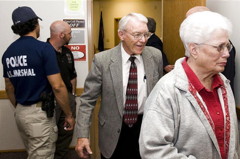 Harold Lyman, center, of Blanding exits a courtroom after a hearing before a judge last June. Lyman and 23 other residents were accused of stealing Native American artifacts.