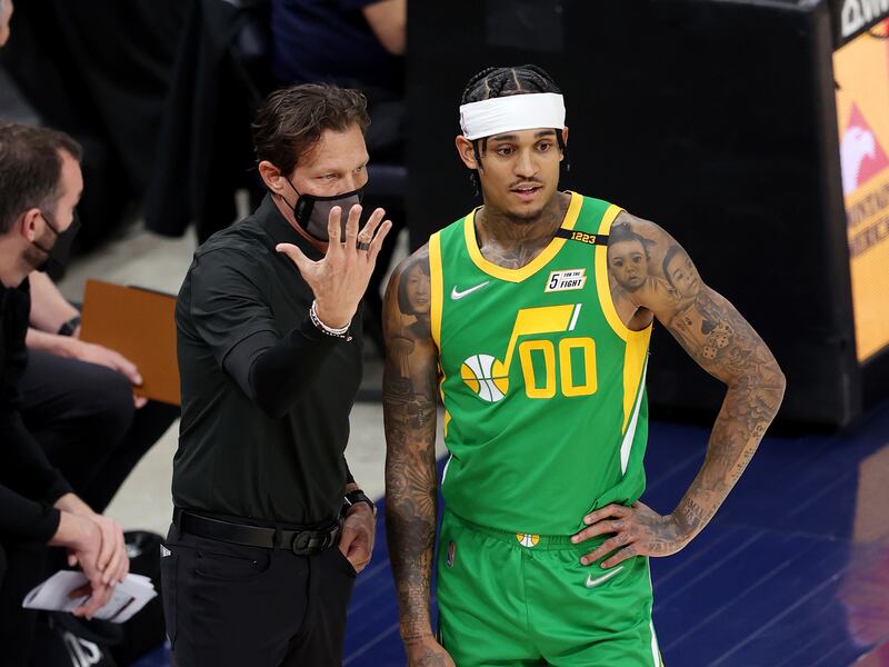 Utah Jazz coach Quin Snyder talks with Jordan Clarkson during a game against the Denver Nuggets at Vivint Arena in Salt Lake City.