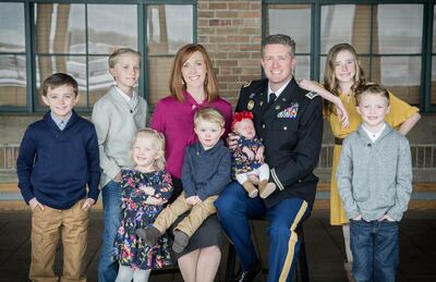 Maj. Brent Taylor is pictured with his wife and seven children.