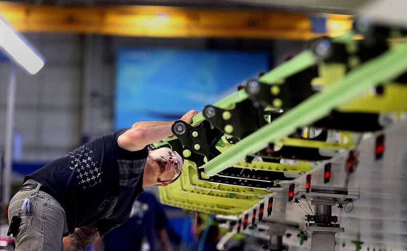 T.J. Duran works on a horizontal stabilizer wing of a Boeing 787 at the assembly facility at Boeing in Salt Lake City on Thursday, Sept. 3, 2015. Utah's manufacturing industry hit a significant milestone this week as Boeing completed its expansion project