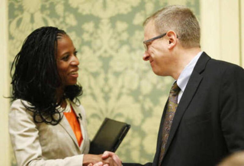 FILE "” Mia Love and Doug Owens shake hands. The race for Utah's 4th District congressional seat is attracting increased national attention, with U.S. House Democrats now targeting Rep. Mia Love, R-Utah.