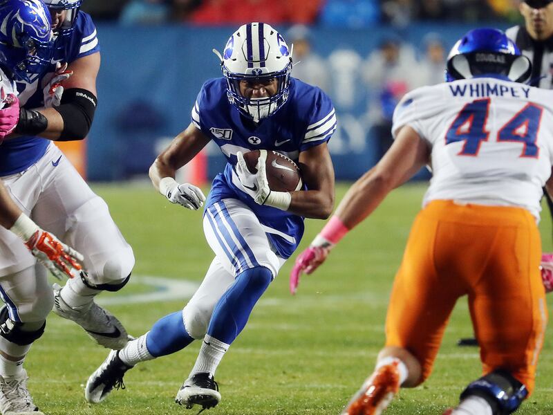 BYU Cougars running back Sione Finau runs the ball against the Boise State Broncos.