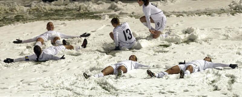 The U.S. team makes snow angels after scoring against Mexico on Wednesday at Rio Tinto Stadium in Sandy.