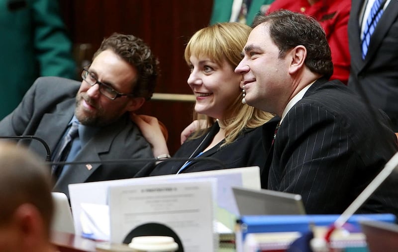 Representatives David Litvack, left, Jennifer Seelig, center, and Brian King pose for a photo prior to the opening of the Utah State Legislature Monday, Jan. 23, 2012 in the House of Representatives in the Utah State Capitol.