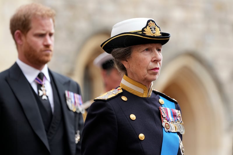Princess Anne and Prince Harry follow the hearse with the coffin of Queen Elizabeth II moving towards St. George’s Chapel at the Windsor Castle in Windsor, England.