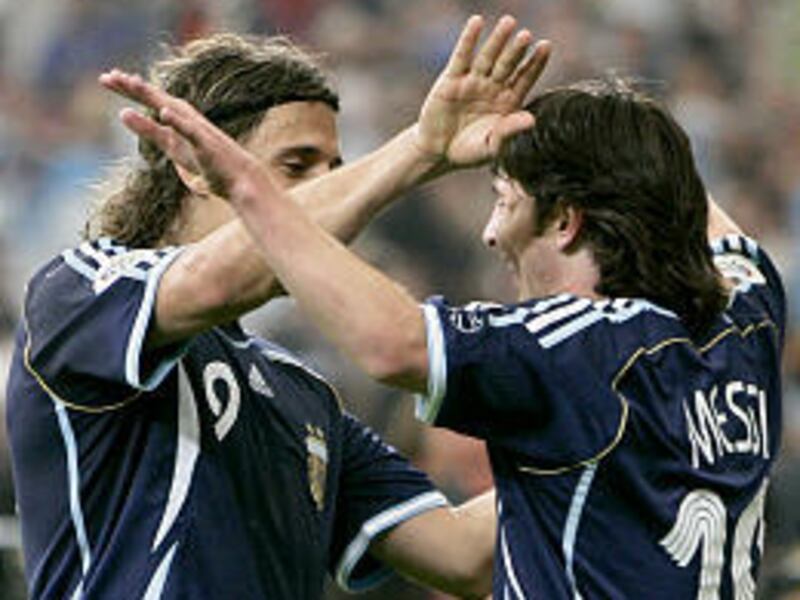 Argentina's Lionel Messi, right, is congratulated Friday by teammate Hernan Crespo after scoring during the Group C soccer match against Serbia and Montenegro at Gelsenkirchen stadium in Germany.