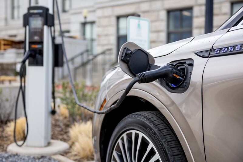 An electric vehicle charges at a charging station at the Capitol in Salt Lake City.