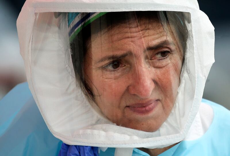 University of Utah Health’s Shelly Archuleta-Boyce sanitizes her gear after administering a free COVID-19 test at Victor’s Event Center in West Valley City on Friday, May 29, 2020. The Consulate of Mexico in Salt Lake City, in collaboration with Victor’s Event Center, the Utah Department of Health and the University of Utah Wellness Bus collaborated for the event.