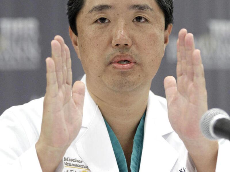 Dr. Dong Kim discusses the size of the implant he placed on U.S. Rep. Gabrielle Giffords' skull, during a news conference to update Giffords' condition Thursday, May 19, 2011, in Houston. Physicians on Wednesday put a plastic implant in place to fully cov