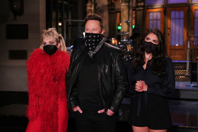 Musical guest Miley Cyrus, host Elon Musk, and Cecily Strong during promos in Studio 8H for “Saturday Night Live.”