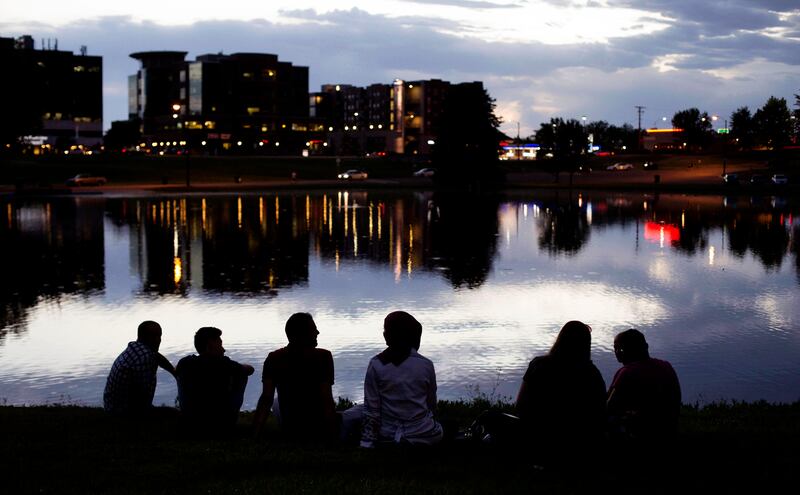 Baraa Huraideen, her husband, Malek Hamad, and friends relax after an Eid ai-Fitr party in Sugarhouse Park on June 26. The Hamads enjoy the religious freedom they have in the United States.