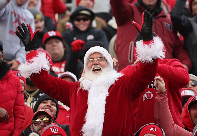 A fan dressed as Santa cheers in Salt Lake City on Nov. 25, 2023.