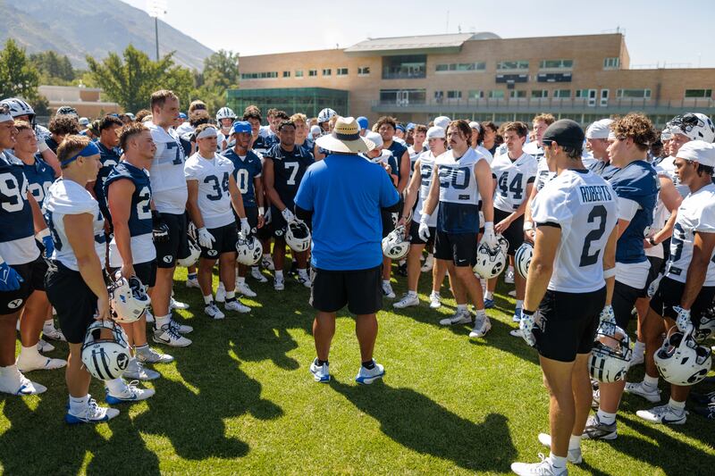 BYU coach Kalani Sitake huddles up his players after a practice on July 31, 2025, in Provo.