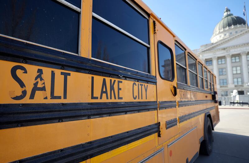 A Salt Lake City School District bus is pictured outside of the Capitol in Salt Lake City.