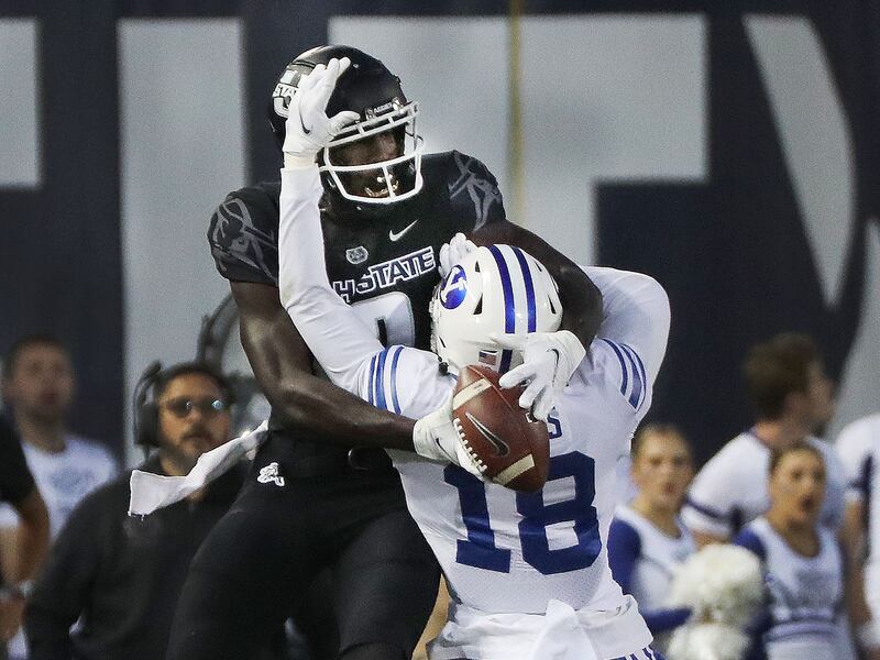 BYU defensive back Kaleb Hayes breaks up a pass intended for Utah State’s Justin McGriff in Logan on Friday, Oct. 1, 2021.