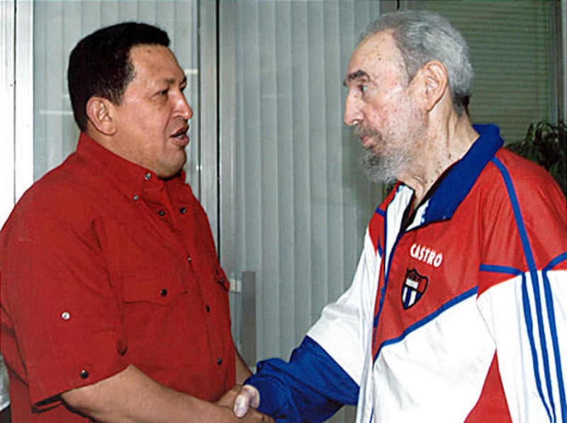 Cuban President Fidel Castro, right, shakes hands with Venezuelan counterpart Hugo Chavez on Saturday in Havana.